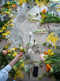 Top view on the table with bouquets at flower workshop