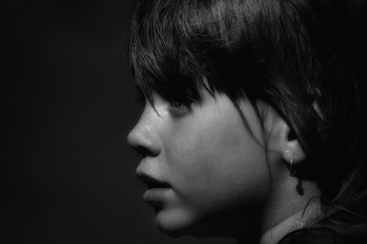 headshot, person, lifestyles, young adult, close-up, leisure activity, eyes closed, human face, young women, contemplation, indoors, studio shot, childhood, front view, looking away, side view, head and shoulders, looking down