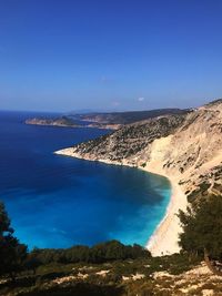 High angle view of sea against clear blue sky
