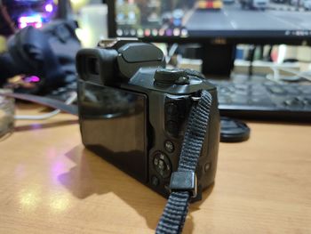 Close-up of camera on table