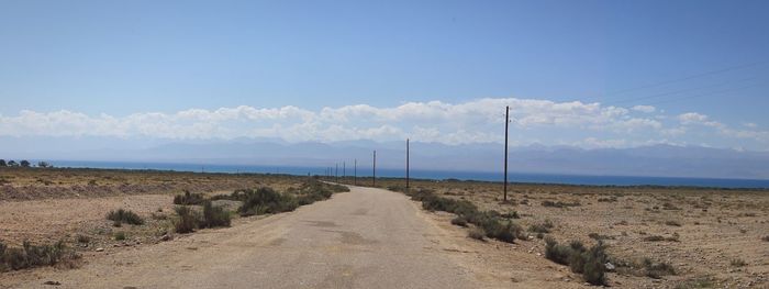 Empty road along landscape