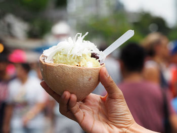 Close-up of hand holding ice cream