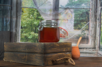 Close-up of drink in glass jar on table