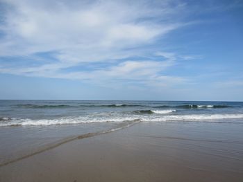 Scenic view of beach against sky