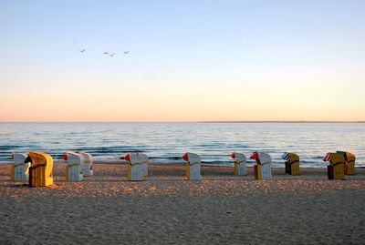 Scenic view of beach against sky during sunset