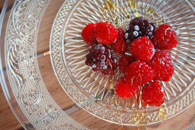 High angle view of strawberries in plate on table