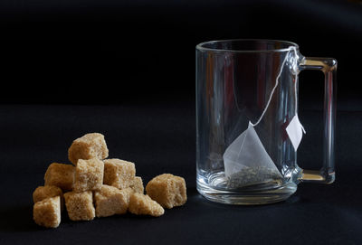 Close-up of cookies in glass on table