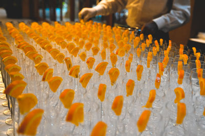 Close-up of orange slices on glasses