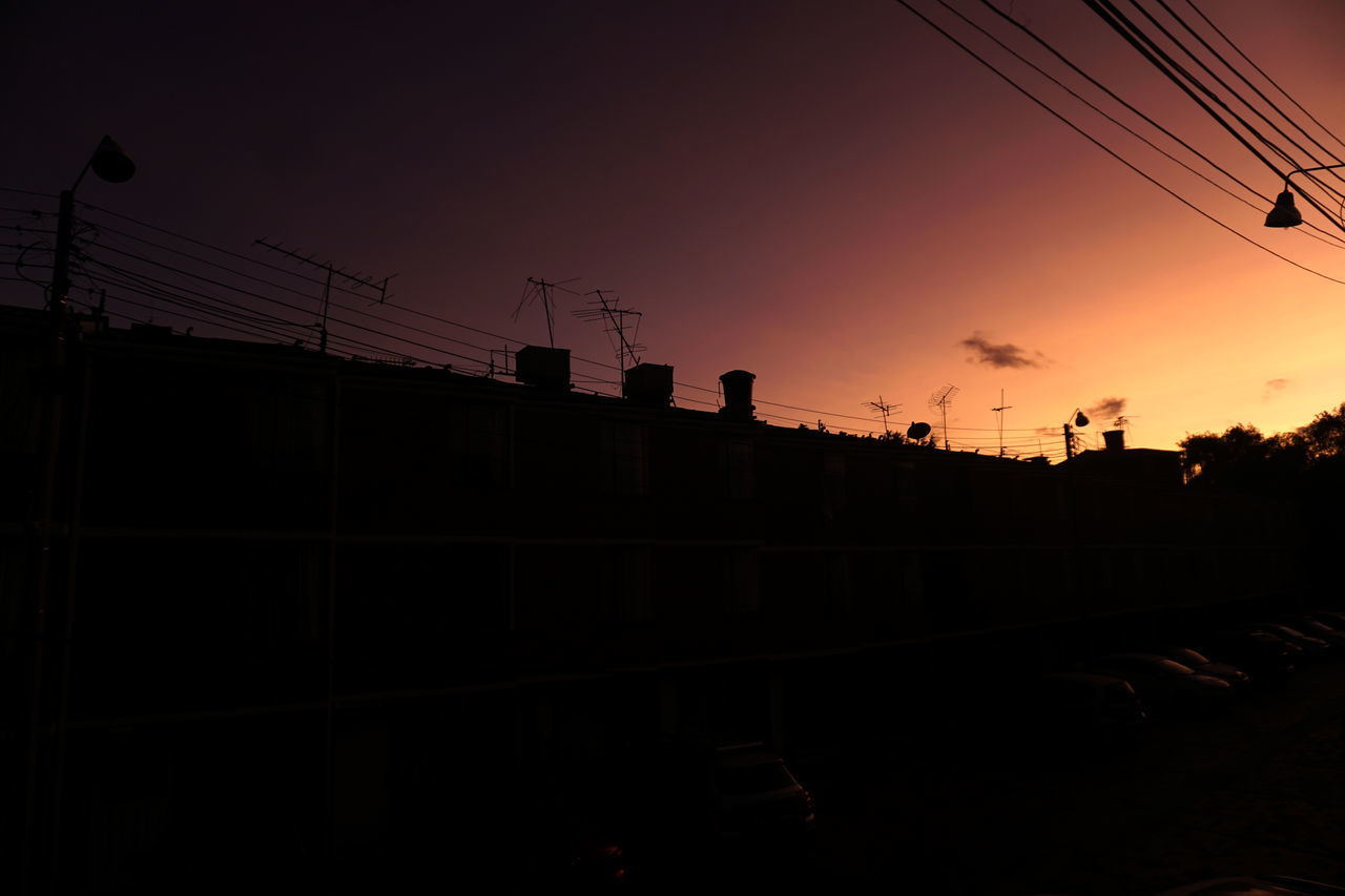 LOW ANGLE VIEW OF SILHOUETTE BRIDGE AGAINST SKY AT SUNSET