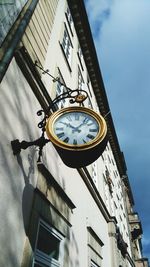 Low angle view of clock tower against sky