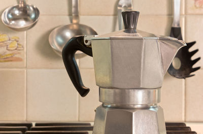 Close-up of coffee cup on table at home