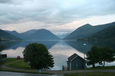 Scenic view of lake and mountains against sky