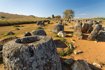 View of old ruins on landscape against sky