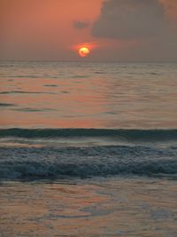 Scenic view of sea at sunset