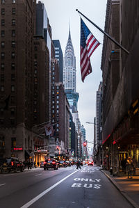 Road amidst buildings in city