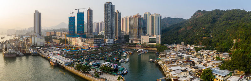 High angle view of river and buildings in city