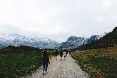Scenic view of snow covered mountains against sky