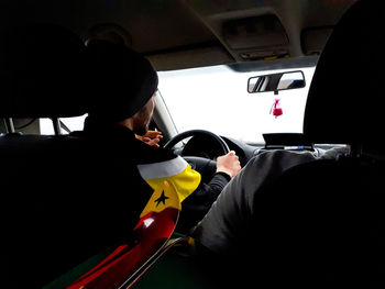 Rear view of man in bus