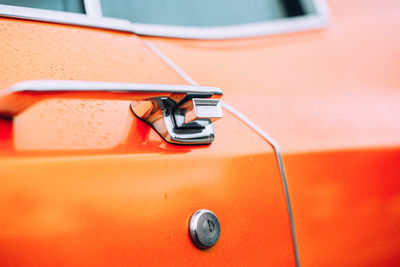 Close-up of orange vintage car
