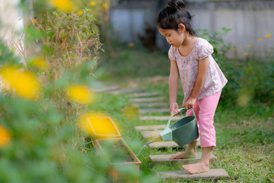 Girl watering flowers