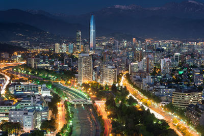 High angle view of illuminated city buildings at night