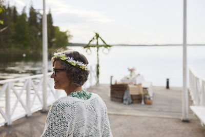 Smiling senior woman with flower wreath