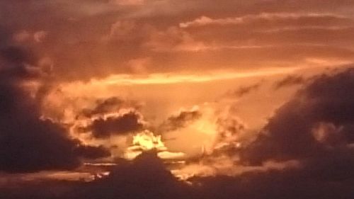 Scenic view of dramatic sky during sunset