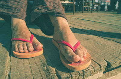 Low section of woman wearing high heels outdoors