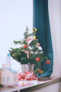 Close-up of christmas tree on table at home