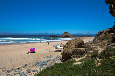 Scenic view of beach against clear sky