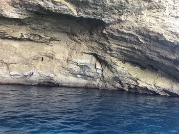 Scenic view of rock formation in sea