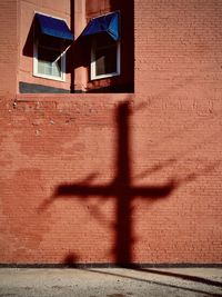 Shadow of window on wall of building