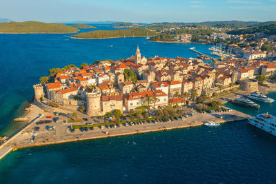 High angle view of townscape by sea