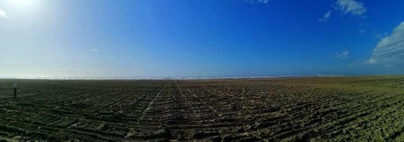 Scenic view of farm against sky