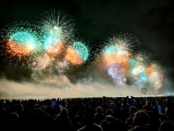 Firework display at night