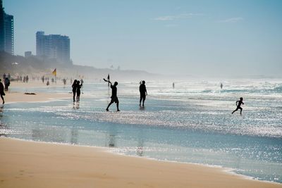 People enjoying at beach