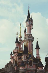 Low angle view of cathedral against cloudy sky