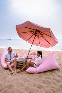 Couple relaxing at beach