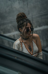 Portrait of young woman in car