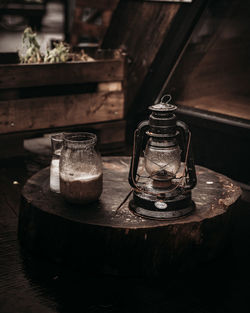 Close-up of illuminated lantern on table