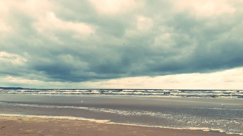 Scenic view of beach against sky