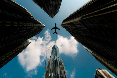 Low angle view of buildings in city against sky