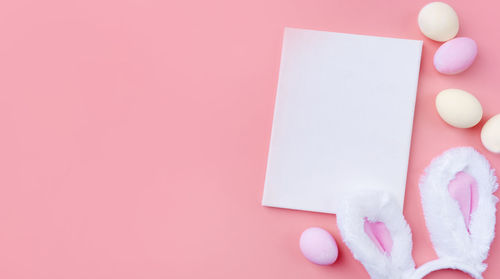 High angle view of heart shape on pink background
