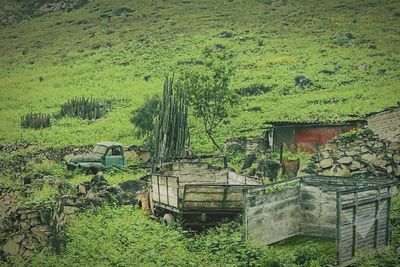 Abandoned house on field