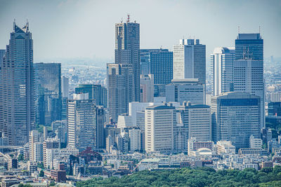 Modern buildings in city against clear sky