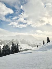 Scenic view of landscape against sky during winter