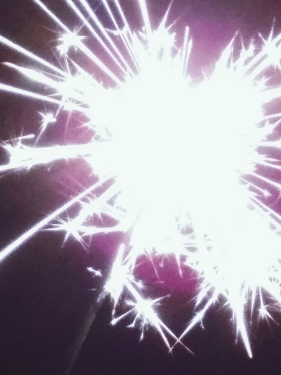 exploding, firework display, celebration, arts culture and entertainment, sparks, firework - man made object, long exposure, sparkler, night, real people, smoke - physical structure, human hand, outdoors, firework, illuminated, motion, sky