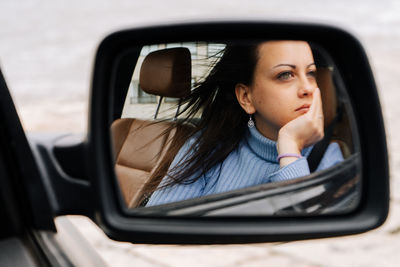 Reflection of road on side-view mirror