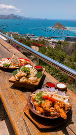 High angle view of food on table against sea