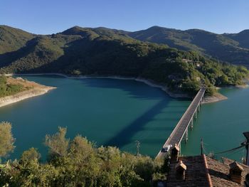 High angle view of bridge over lake lago del turano